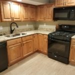 Updated kitchen with wood cabinets, granite countertops, and new appliances